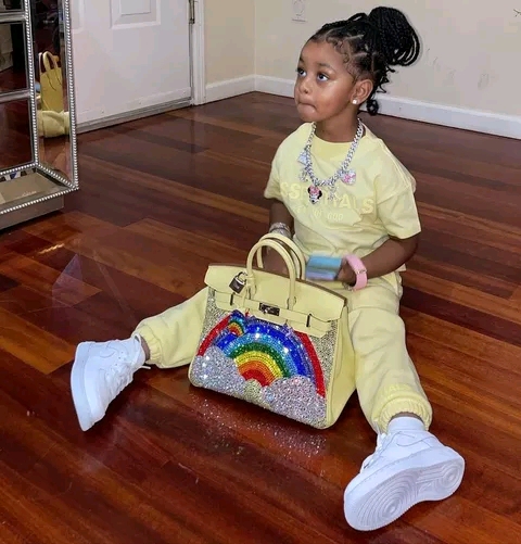 Would you give a two-year-old a Hermès or LV handbag, as Cardi B