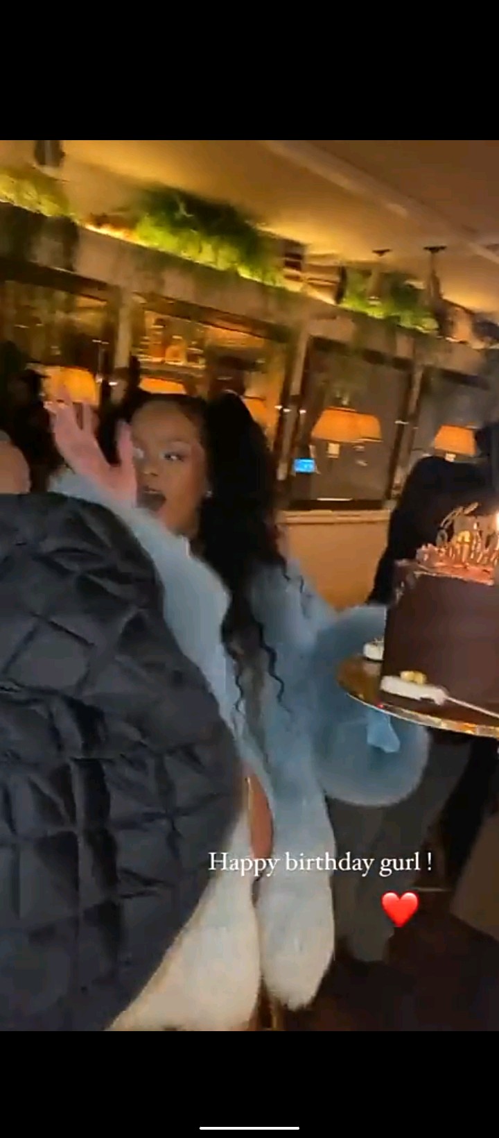 Pregnant Rihanna shows her baby bump in blue fur coat as she celebrates her 34th birthday