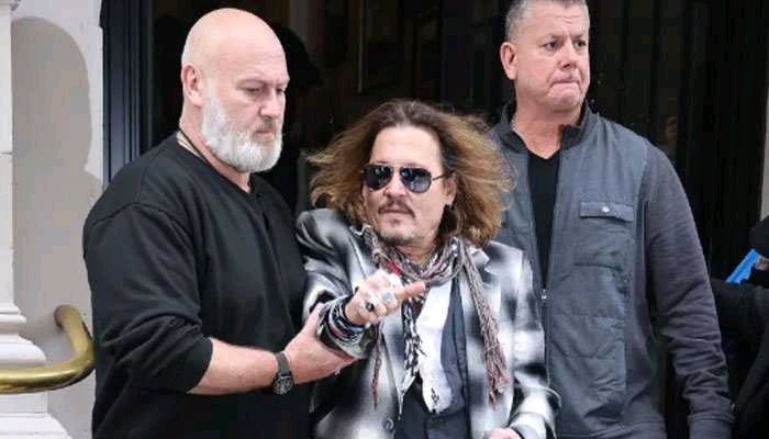 Johnny Depp 'distressed' as security escorts him out of Birmingham hotel