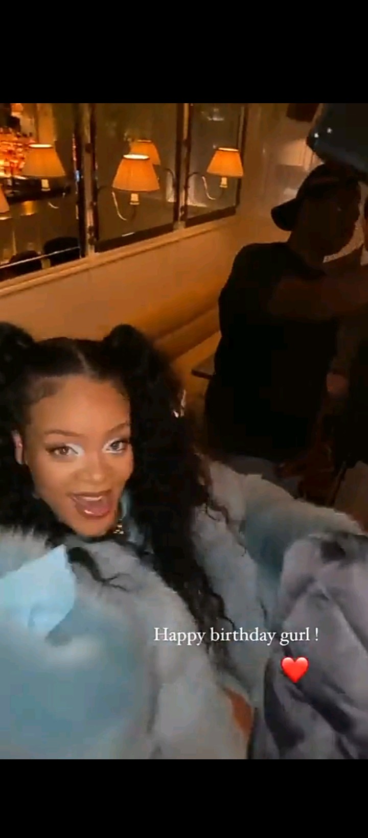 Pregnant Rihanna shows her baby bump in blue fur coat as she celebrates her 34th birthday