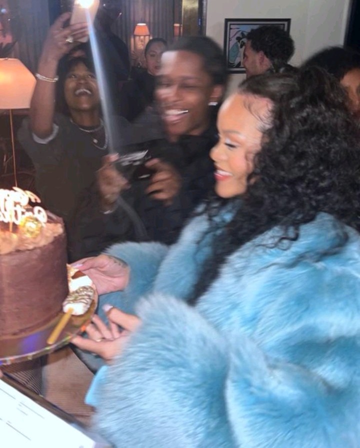 Rihanna gives peek at baby bump in a cozy leopard zip-up and black