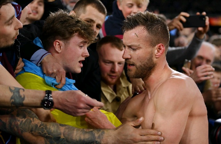 Andriy Yarmolenko give West Ham shirt to a fan holding Ukraine flag after Europa League winner 