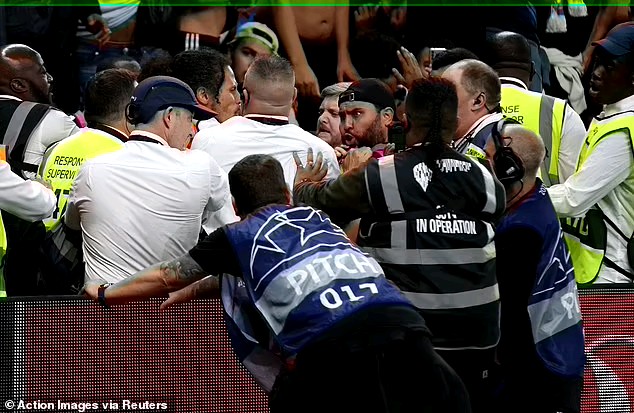 Police make five arrests after Tottenham and Marseille fans clash in the stands following Champions 