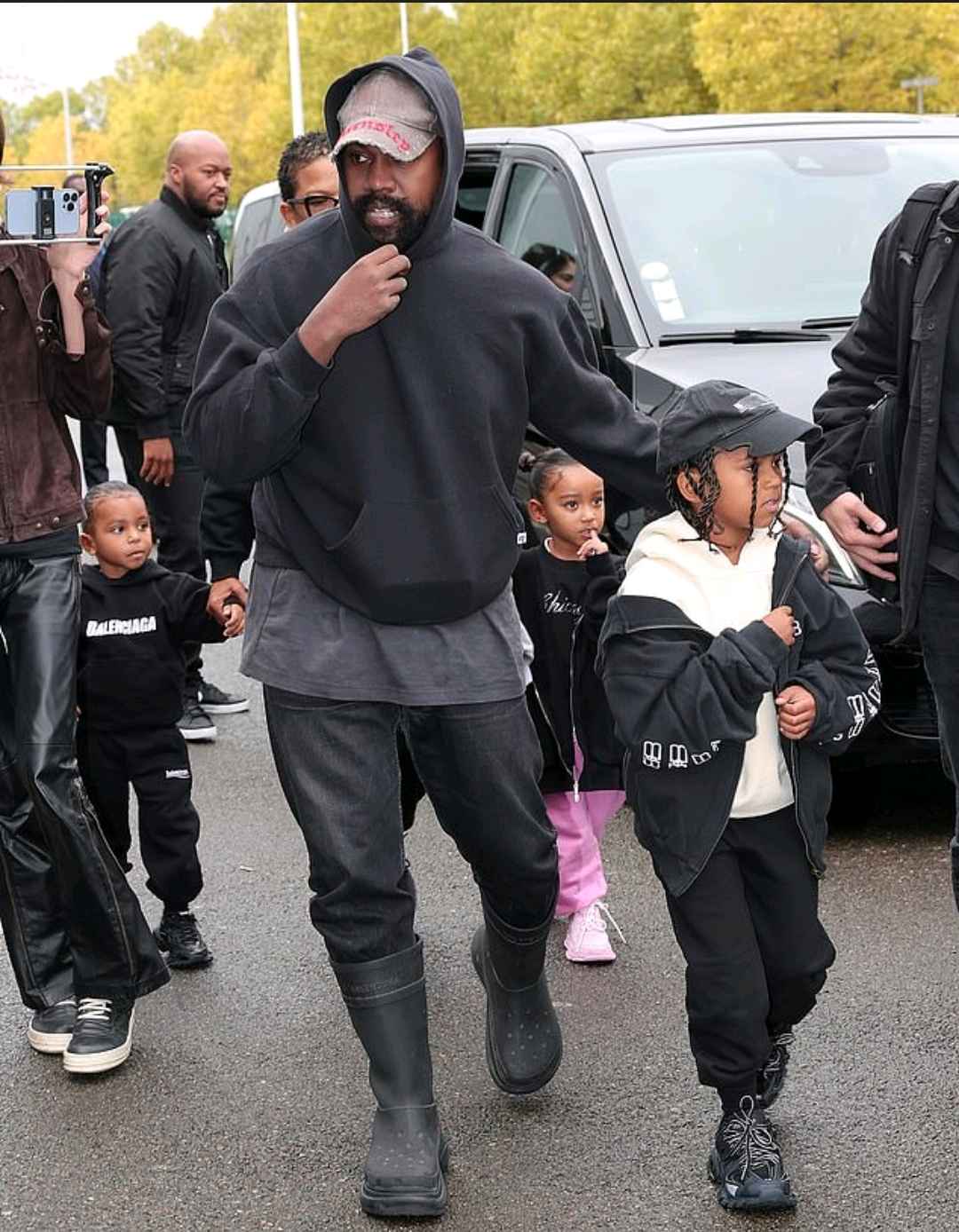 Kanye West is on daddy duty during Paris Fashion Week as he takes his kids to dinner