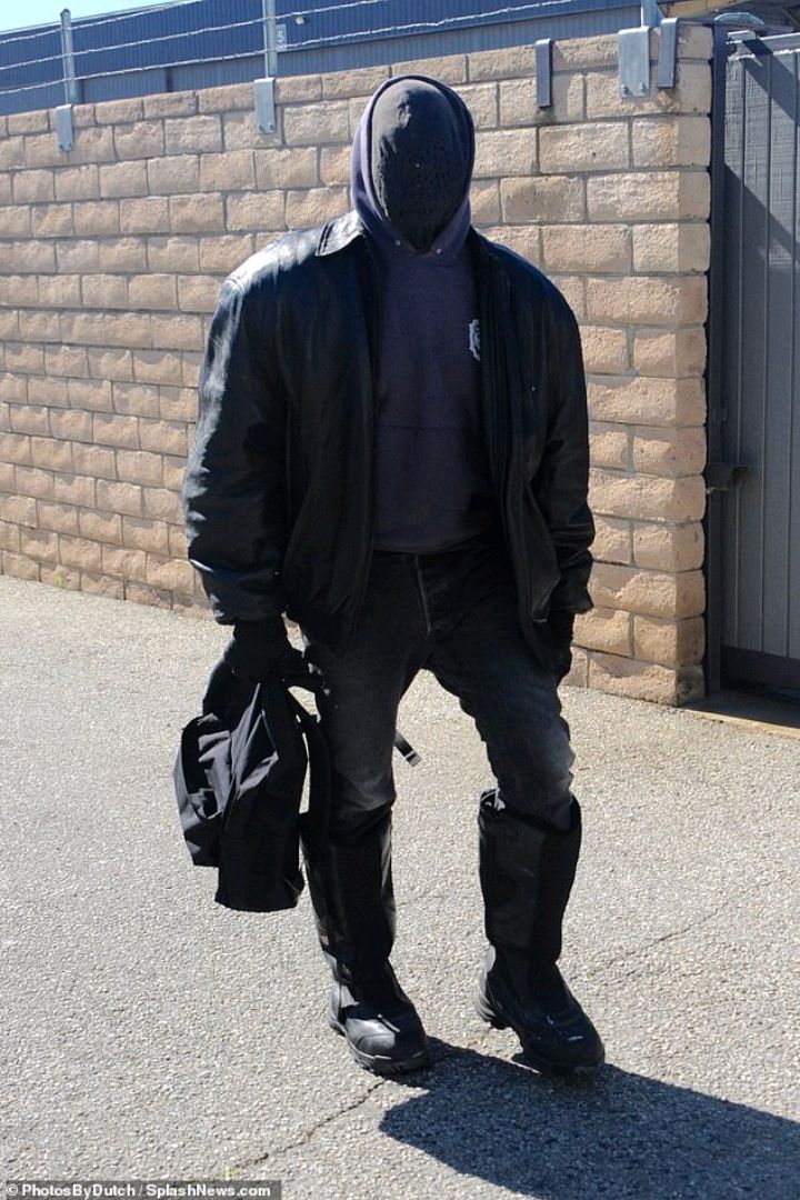 Kanye West rocks signature silhouette featuring a face covering