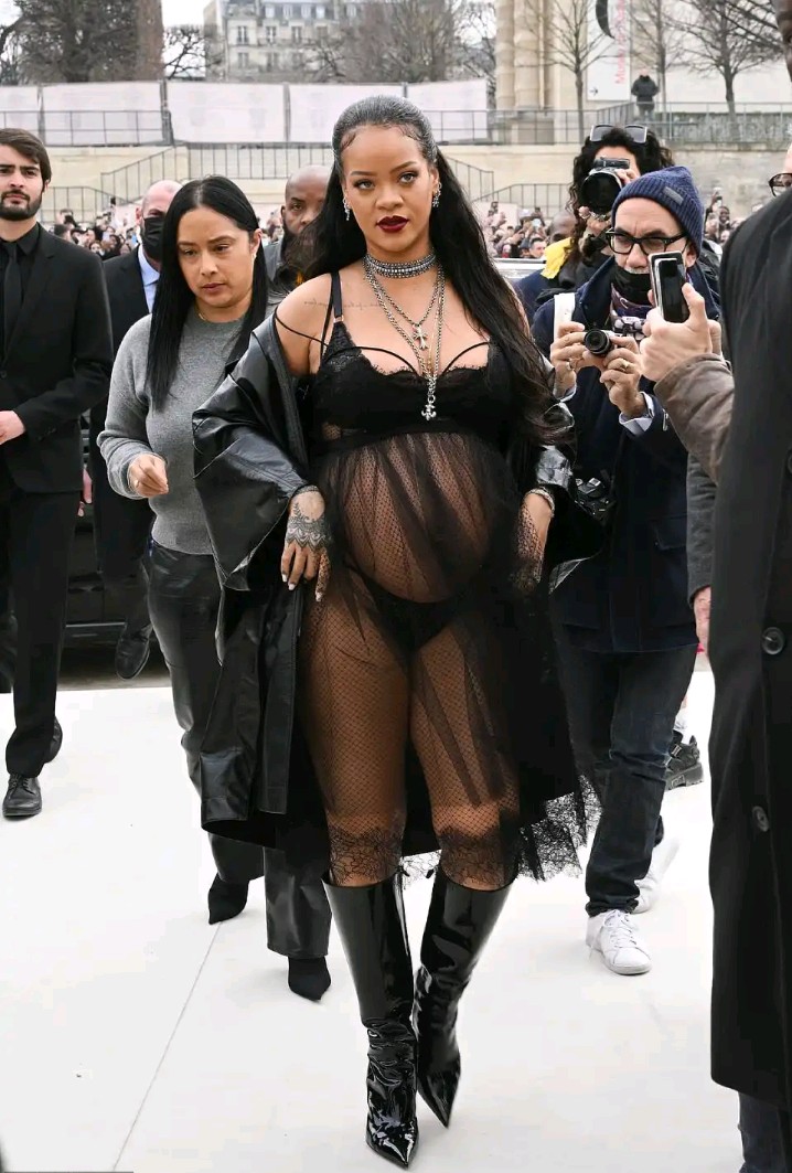 Pregnant Rihanna braves cold as she arrives at Paris Fashion Week Dior show in lingerie