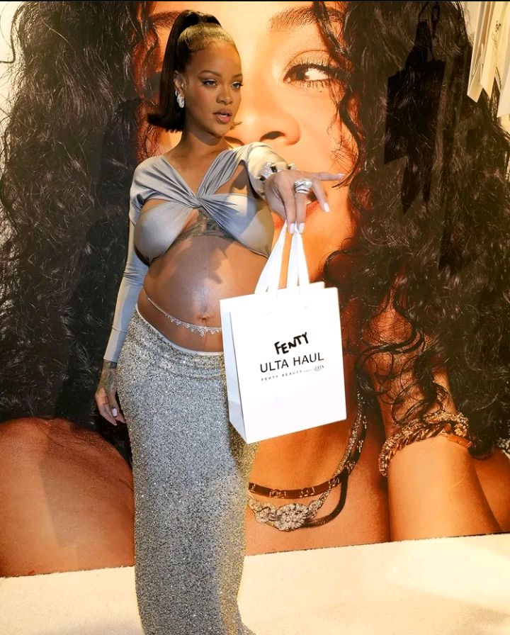 Pregnant Rihanna Sparkles in Silver for Fenty Beauty Launch at Ulta