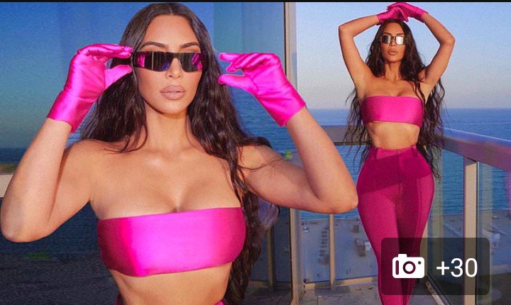 Kim is hot in pink as she poses up a storm in SKIMS bandeau and