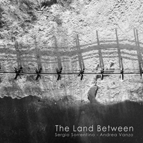 The Land Between ft. Sergio Sorrentino | Boomplay Music