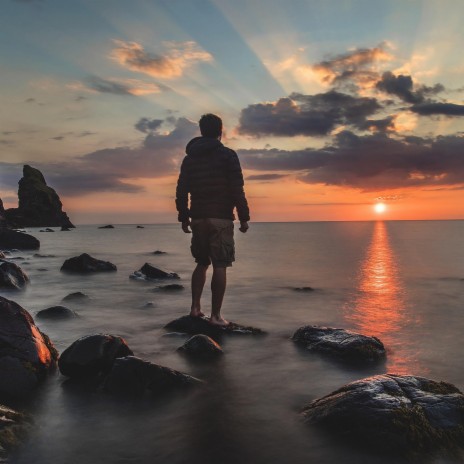 Sunset in front of the rocks of life | Boomplay Music