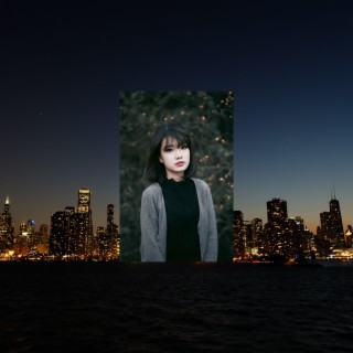 jpg of a girl in the middle of a night city EP