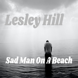 Sad Man On A Beach