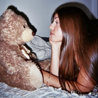 she & her teddy bear
