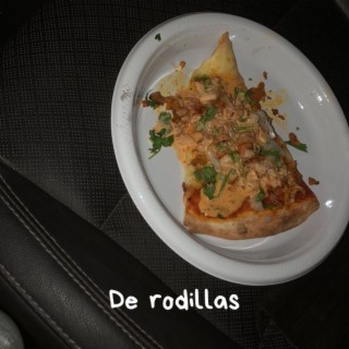 de rodillas