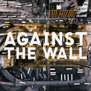 Against the wall