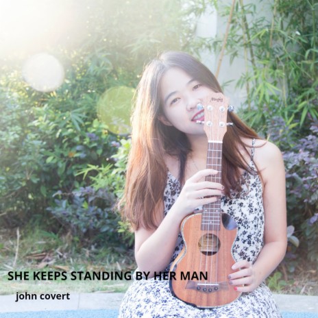 She Keeps Standing by Her Man | Boomplay Music