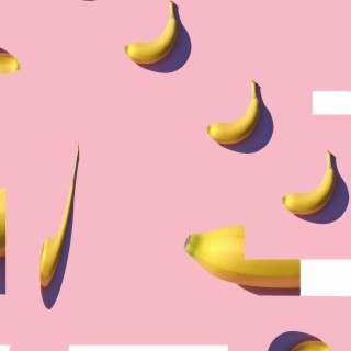 riped banana on pink surface photo EP